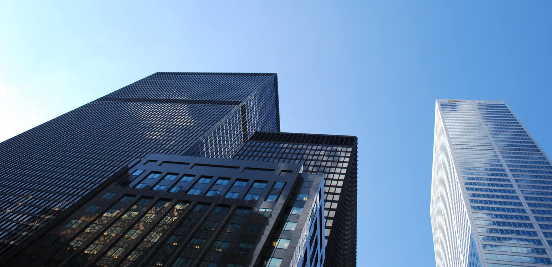 Corporate skyscrapers against blue sky
